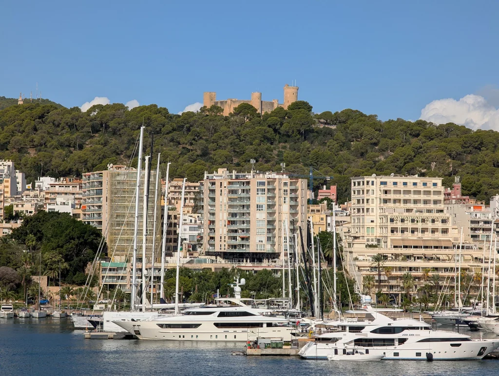 Bellver Castle above Palma marina in Mallorca with yachts in the foreground