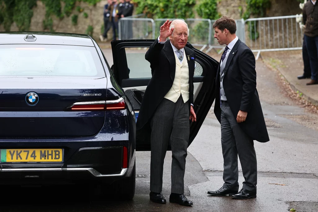 King Charles arriving at Peter Phillips and Harriet Sperling wedding in Kemble