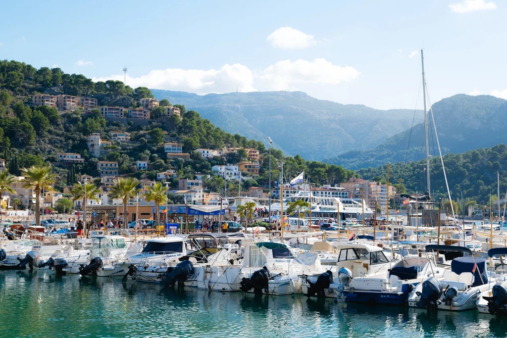 Mallorca luxury travel guide view of Port de Sóller marina beneath the Serra de Tramuntana