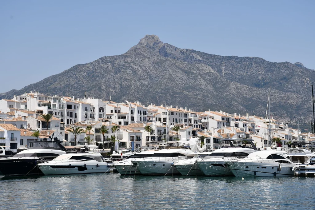Yachts in Puerto Banús marina with La Concha mountain behind Marbella.