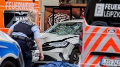 Two killed and many injured after car driven into crowd in German city of Leipzig