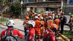 Rescuers inch closer to quake survivor after eight days – and he's cheering them on