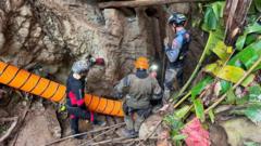 Four more men freed from flooded Laos cave after 10 days